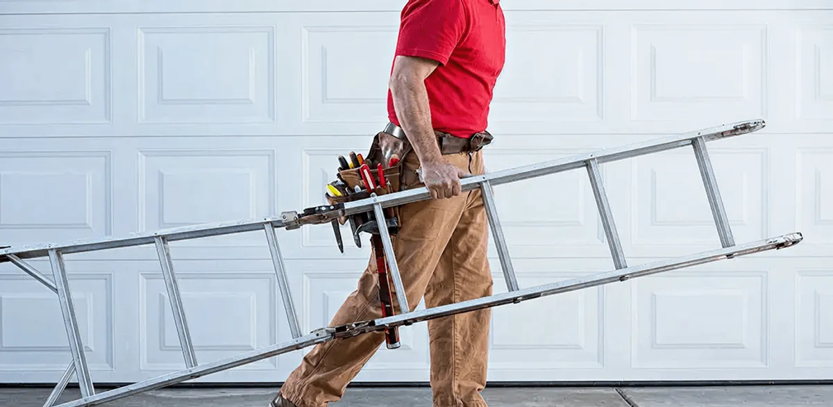 Garage door repair technician arriving with tools and ladder in Springfield, MO