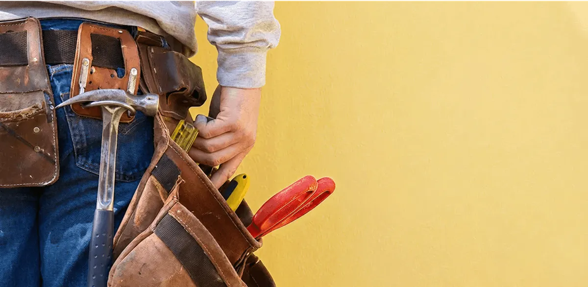 Handyman with tool belt ready for home repairs and maintenance in Springfield, MO